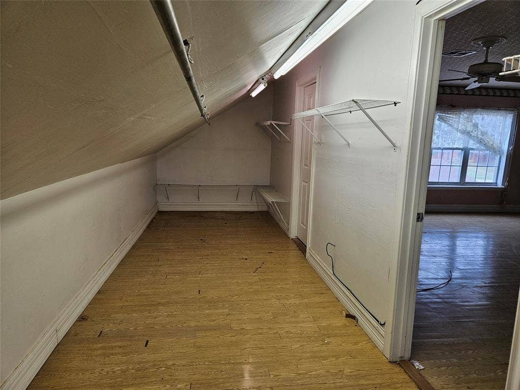 716 Dogwood Street, Robinson, TX 76706 Walk in closet with light wood-type flooring, vaulted ceiling, and a ceiling fan