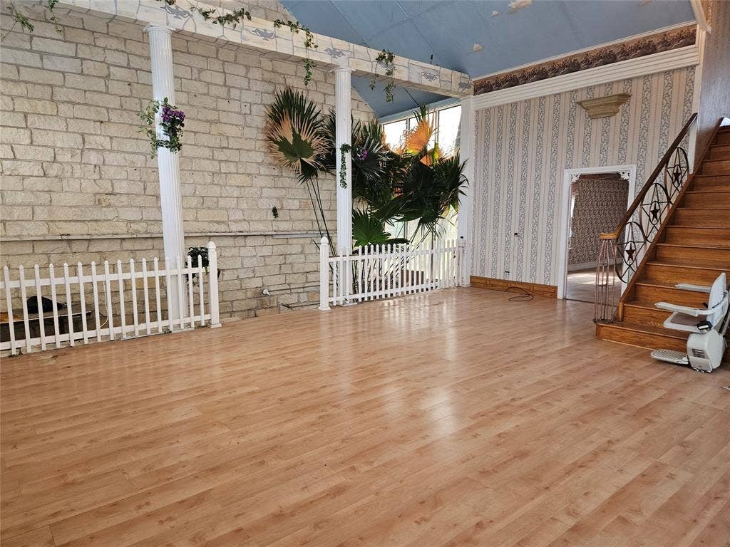 716 Dogwood Street, Robinson, TX 76706 Unfurnished living room featuring lofted ceiling and wood finished floors