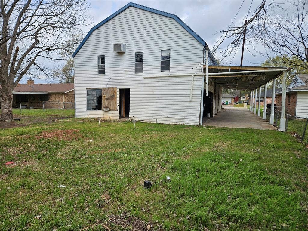 716 Dogwood Street, Robinson, TX 76706 Back of property with a carport and a gambrel roof