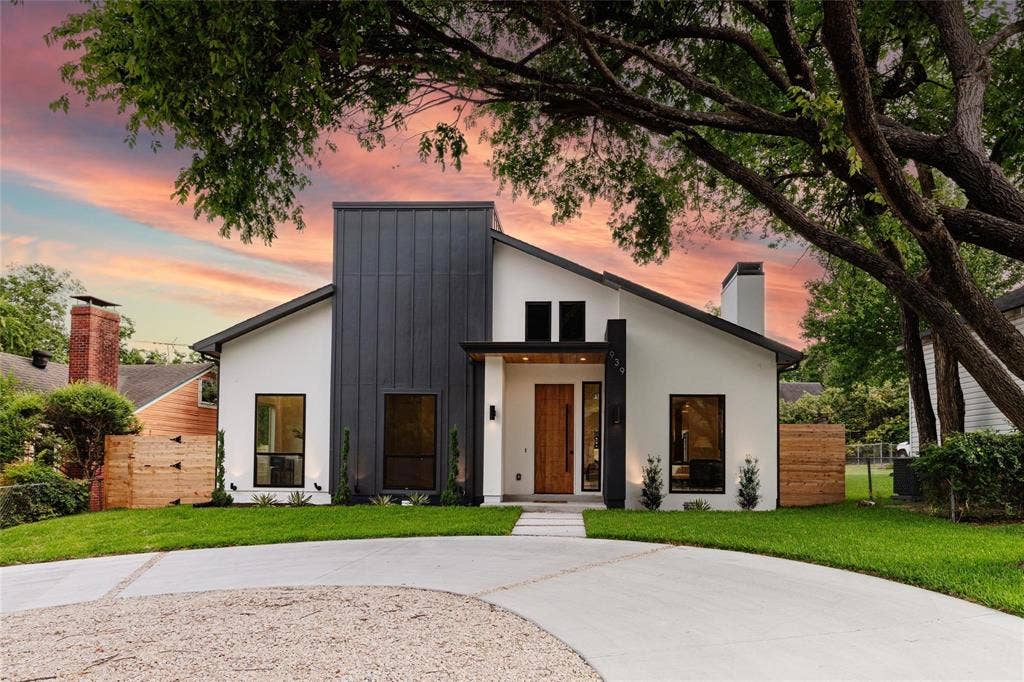 939 N Buckner Boulevard, Dallas, TX 75218 Modern exterior with a contrasting dark vertical siding accent and white stucco