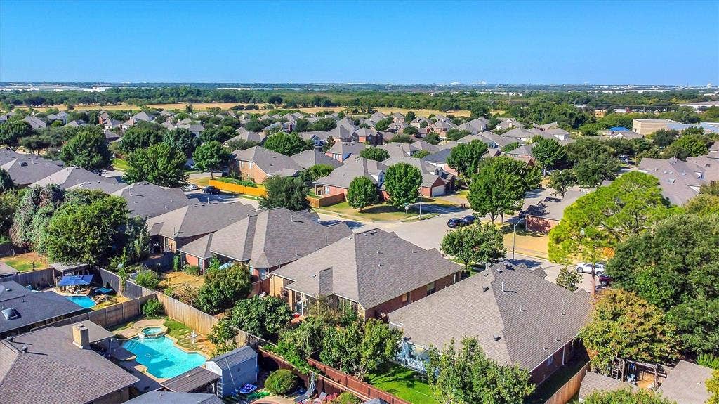 1506 Park Grove Drive, Irving, TX 75060 Residential neighborhood setting with mature trees and visible backyard pools
