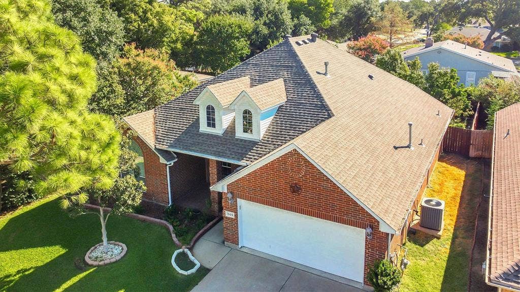 1506 Park Grove Drive, Irving, TX 75060 Brick exterior with a white garage door