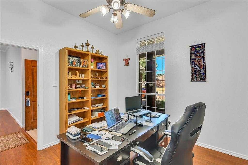 1506 Park Grove Drive, Irving, TX 75060 Recessed lighting, wood-finish flooring, a ceiling fan, and a large window with horizontal blinds