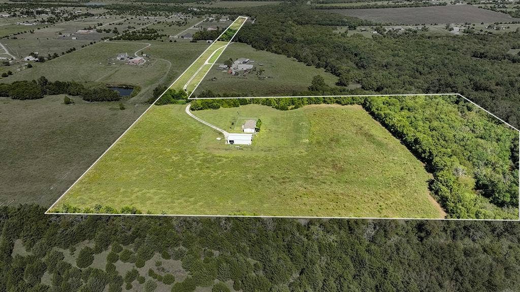 20132 County Road 818, Farmersville, TX 75442 Expansive property featuring a mix of open grassy areas and mature tree lines