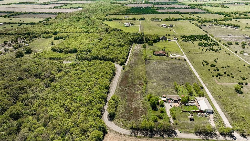 20132 County Road 818, Farmersville, TX 75442 Expansive land featuring wooded areas and cleared fields