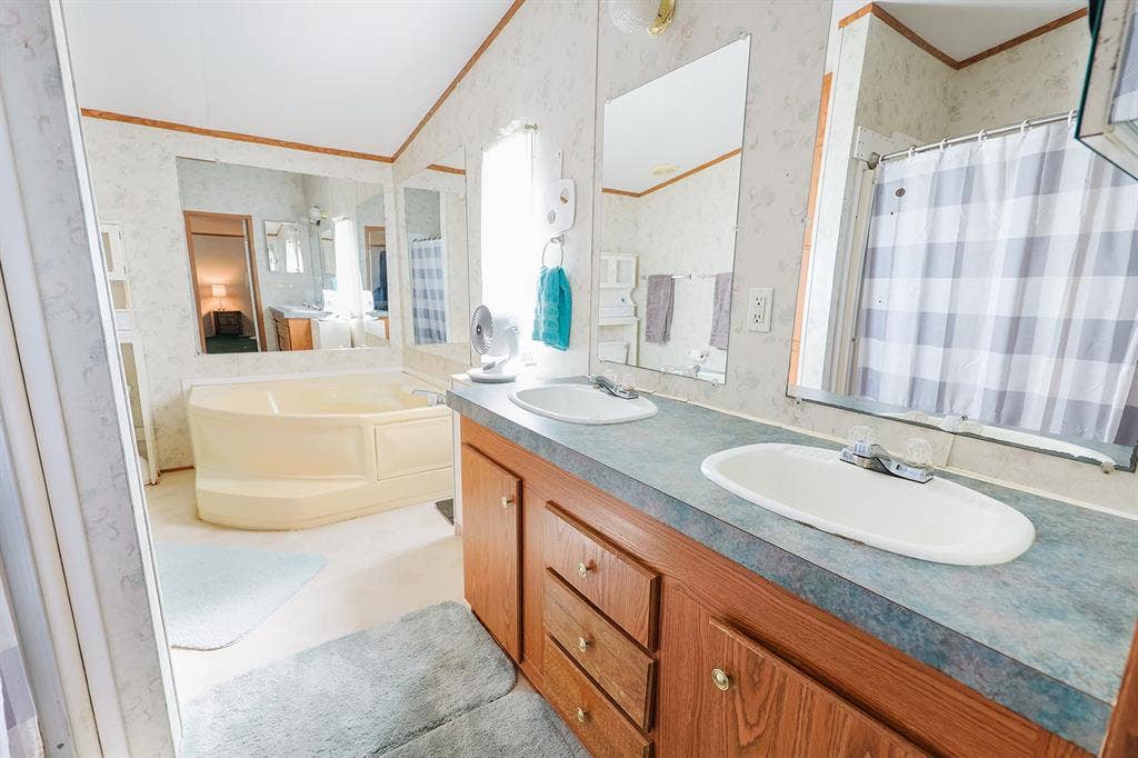 20132 County Road 818, Farmersville, TX 75442 Dual vanity with integrated sinks and wood-finish cabinetry