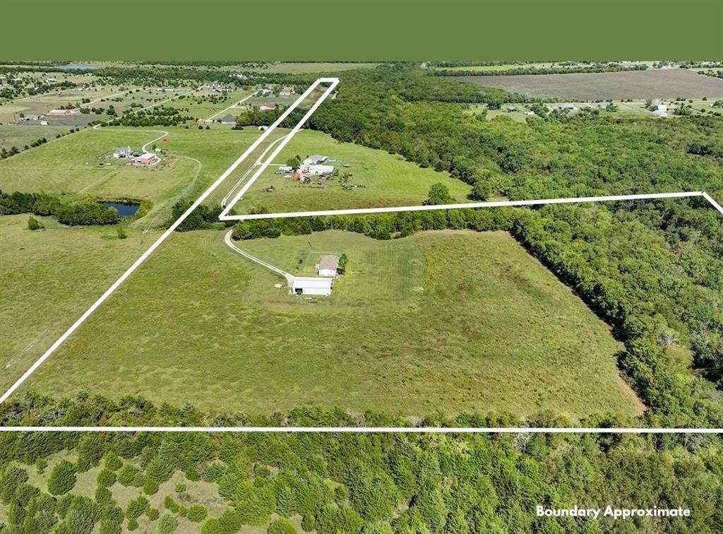 20132 County Road 818, Farmersville, TX 75442 Expansive property featuring a combination of open fields and densely wooded areas