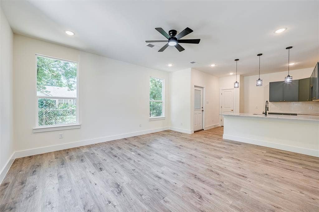 4418 Myrtle, Dallas, TX 75215 Open-concept living space featuring wood-finish flooring, recessed lighting, and a contemporary ceiling fan
