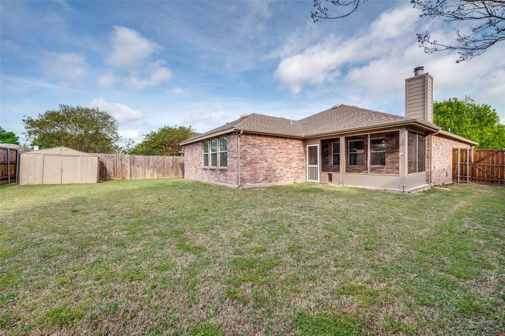 Large backyard showing newly built screened backporch.