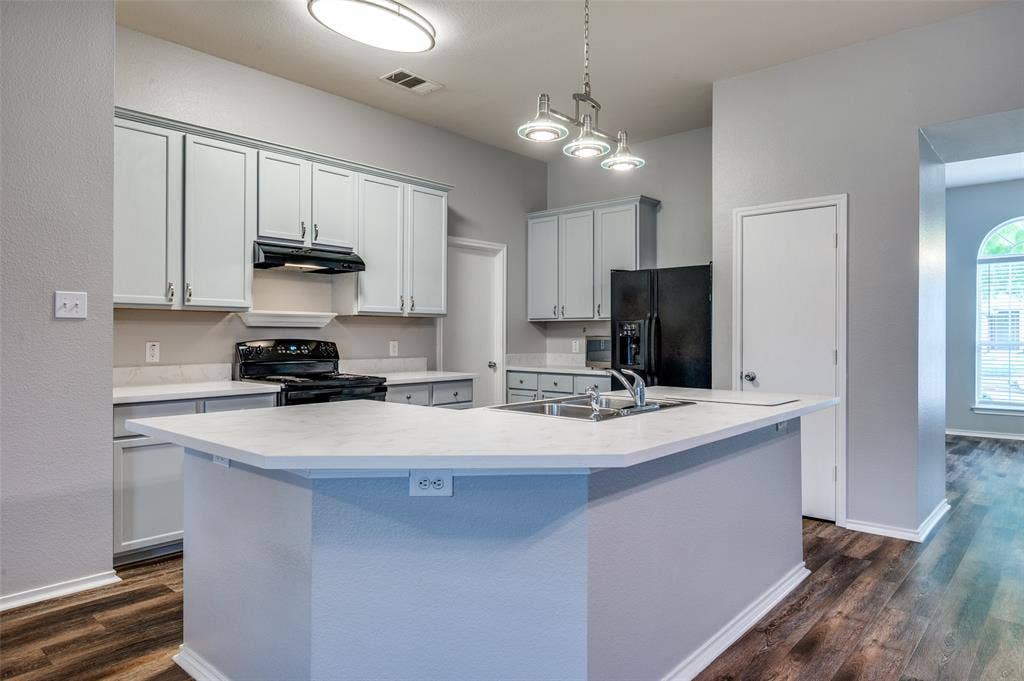 New lighting and bright eat-in kitchen bar.