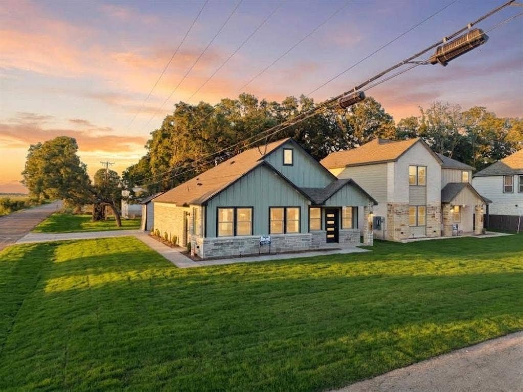 101 Water Oak Road, Trinidad, TX 75163 Siding exterior with stone veneer accents, multi-pane windows, and a dark entry door
