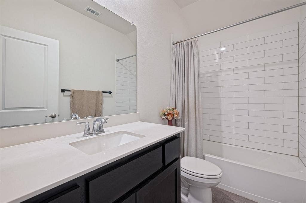 1429 Green Valley Way, Celina, TX 75009 Integrated vanity with an undermount sink, chrome faucet, and expansive countertop