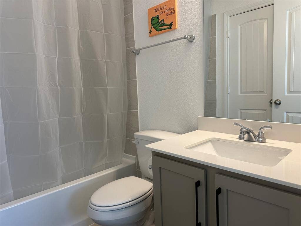 2117 Proteus Drive, Haslet, TX 76052 2nd Primary Full bathroom featuring vanity, toilet, and shower / bath combo with shower curtain