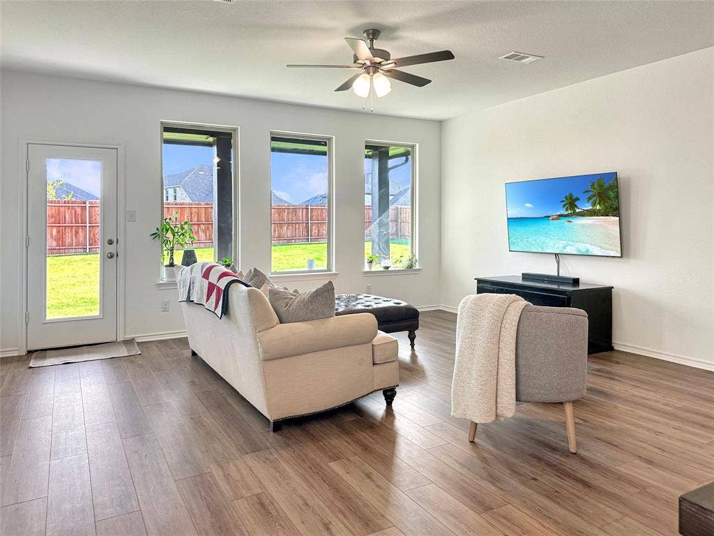 2117 Proteus Drive, Haslet, TX 76052 Living room featuring hardwood / wood-style floors and ceiling fan