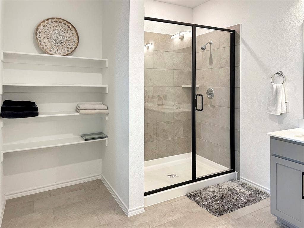 2117 Proteus Drive, Haslet, TX 76052 Bathroom featuring vanity and a shower with shower door