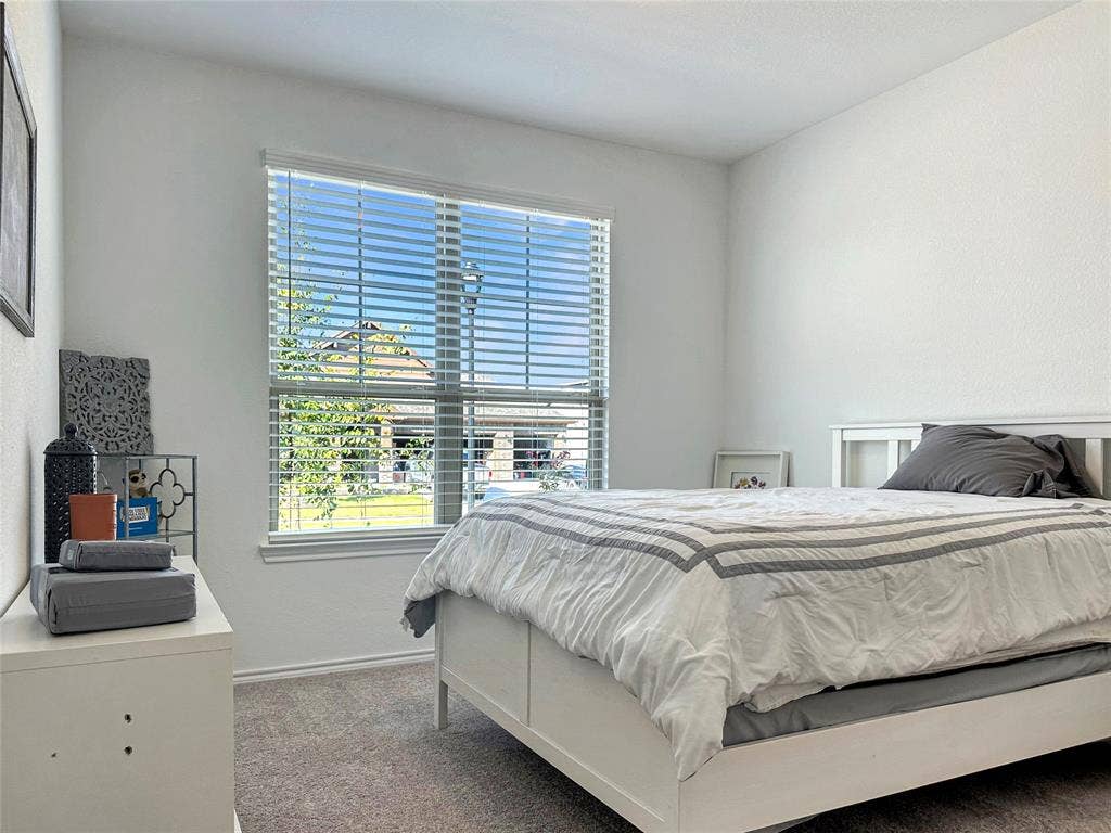 2117 Proteus Drive, Haslet, TX 76052 Carpeted 2nd primary bedroom with multiple windows