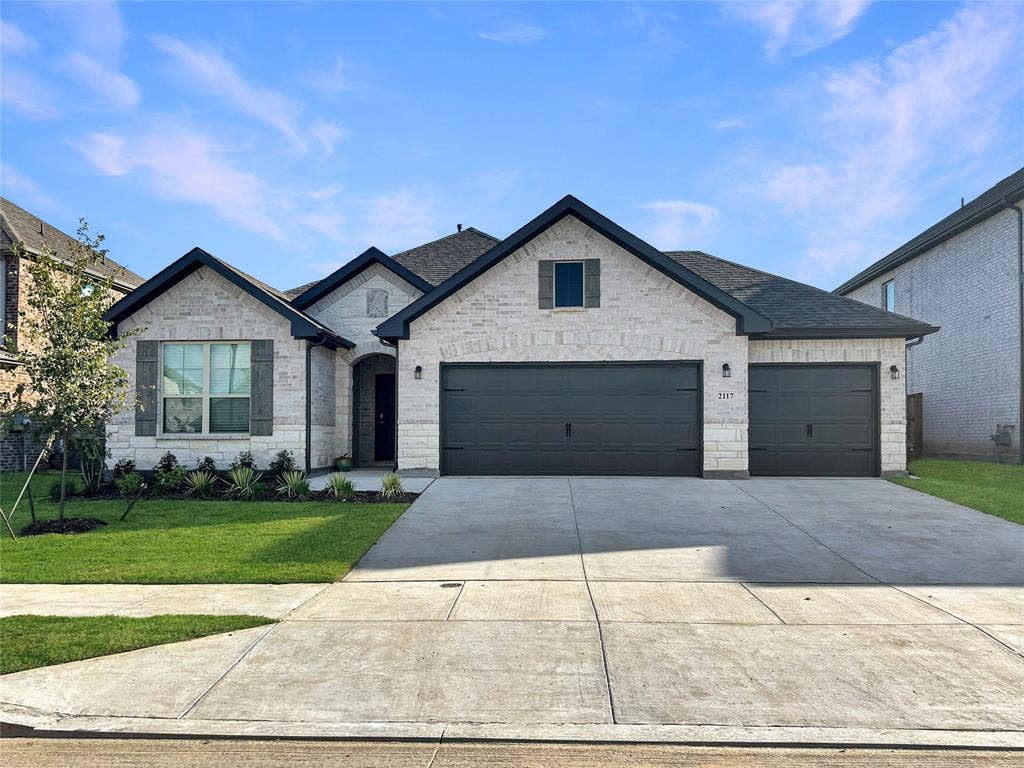 2117 Proteus Drive, Haslet, TX 76052 View of front of home with a 3 garage and a front yard