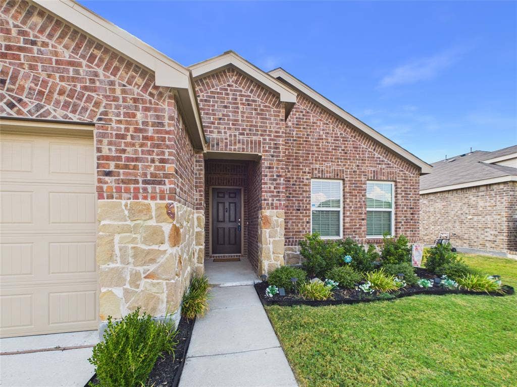 16039 Malaya Street, Haslet, TX 76052 Landscaped front yard and nice walk up to the front door.