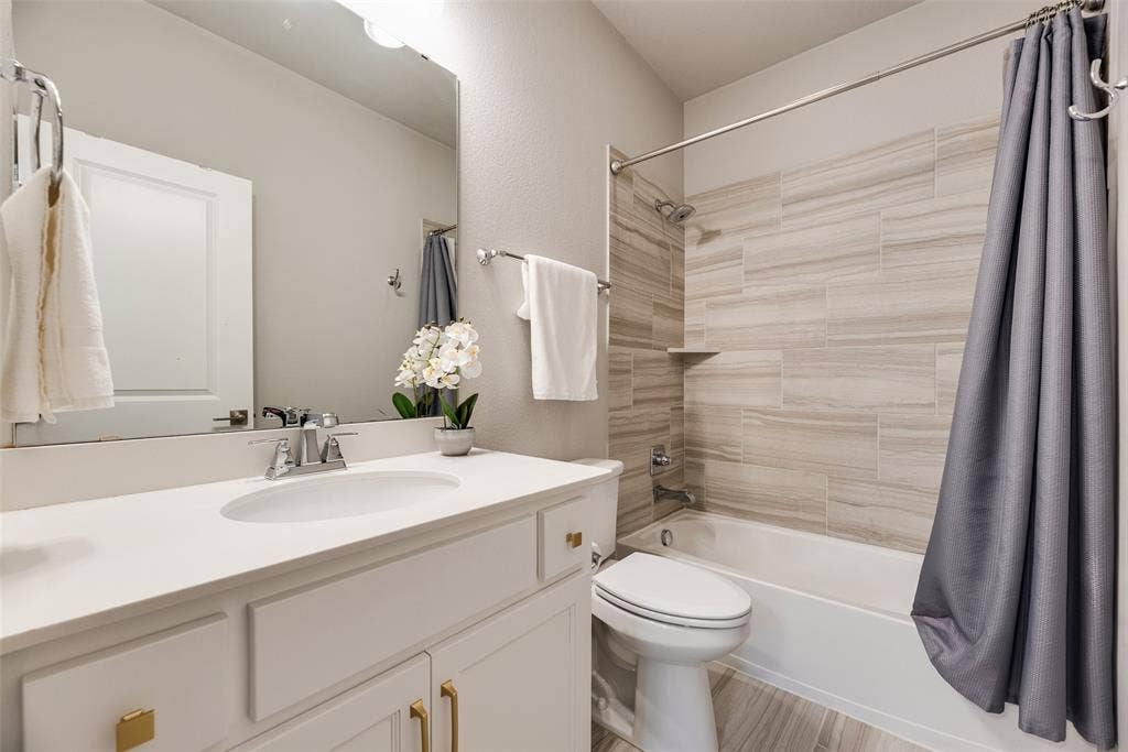 White single-basin vanity with a light-colored countertop