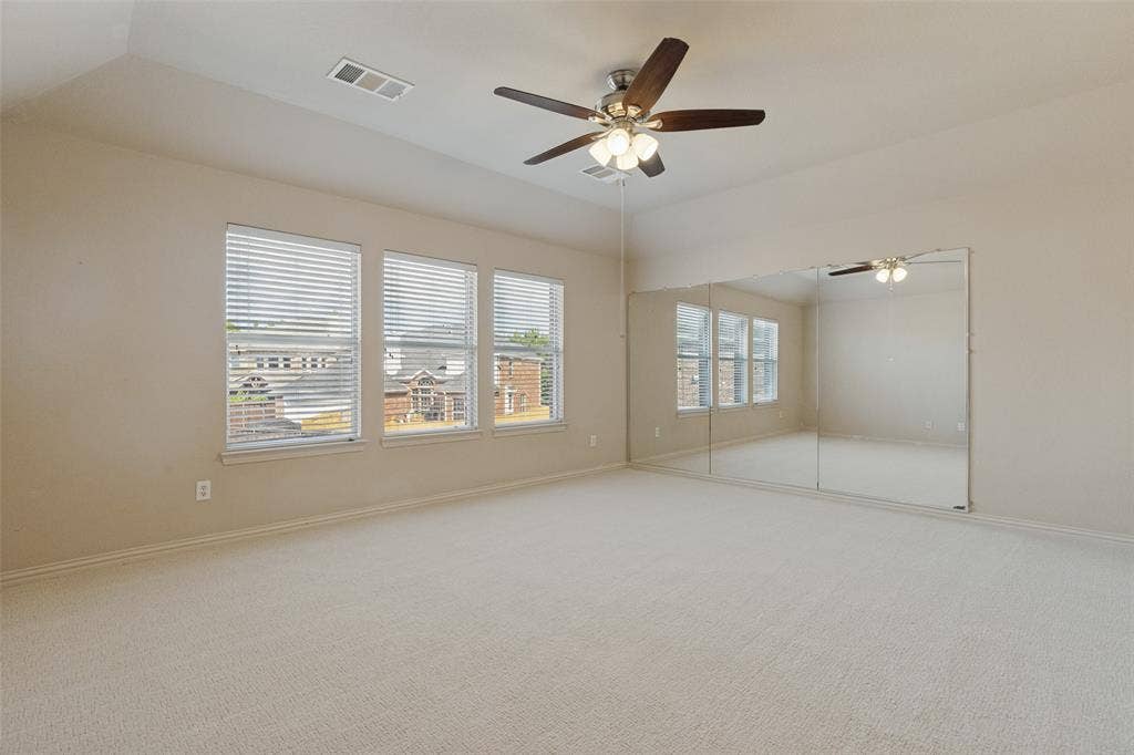 10796 Astoria Drive, Frisco, TX 75035 Oversized upstairs game room offers plenty of space for entertaining and relaxing, featuring brand-new carpet, a ceiling fan, and abundant natural light.