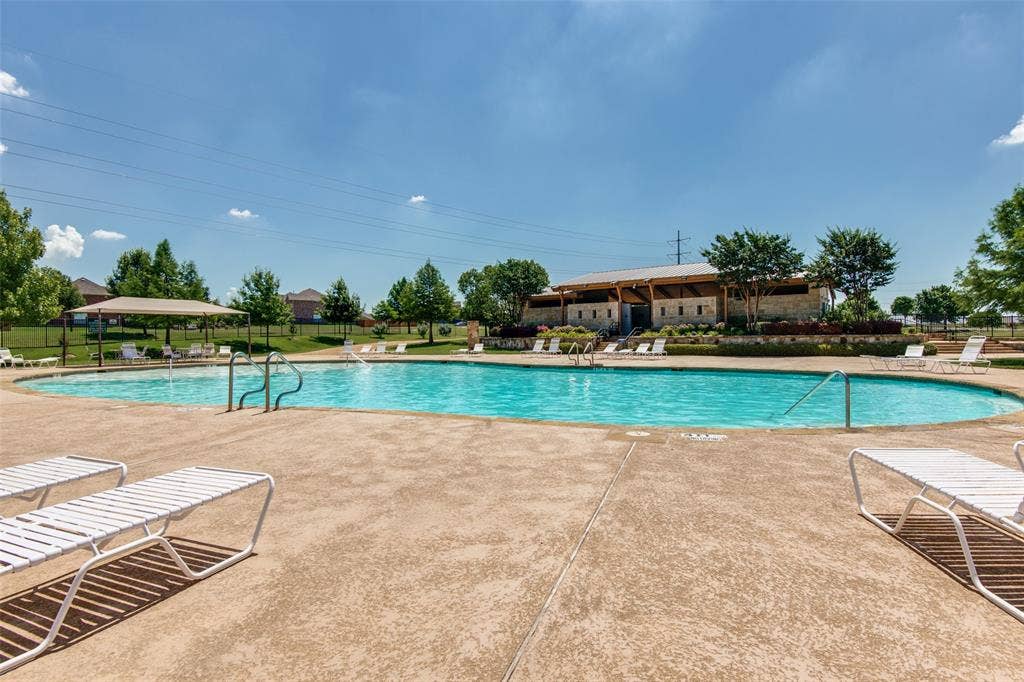 10796 Astoria Drive, Frisco, TX 75035 Enjoy sunny days at the Panther Creek community pool—perfect for relaxing, cooling off, and enjoying the neighborhood amenities.