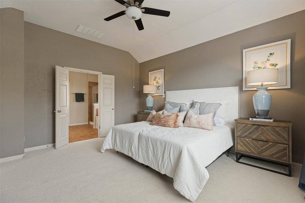 10796 Astoria Drive, Frisco, TX 75035 Generously sized primary suite offers plenty of room to unwind, with a vaulted ceiling and convenient access to the private ensuite bath.