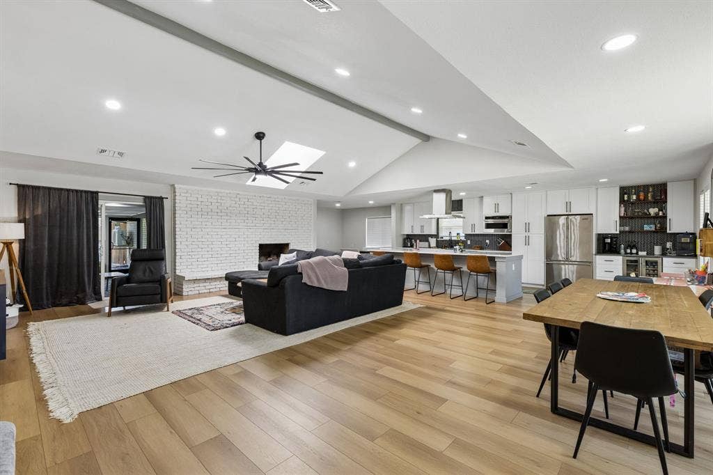 2408 Grandview Drive, Plano, TX 75075 Vaulted ceiling with recessed lighting, skylight, and contemporary ceiling fan
