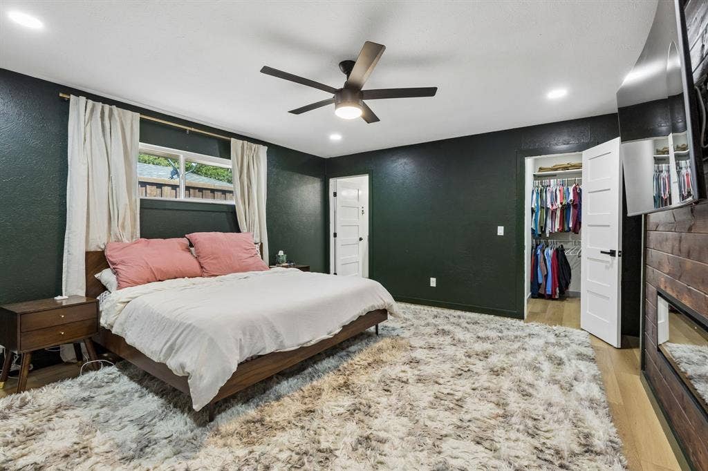 2408 Grandview Drive, Plano, TX 75075 Recessed lighting, ceiling fan, wood-finish flooring, white paneled door, and a built-in wall unit with a mounted television