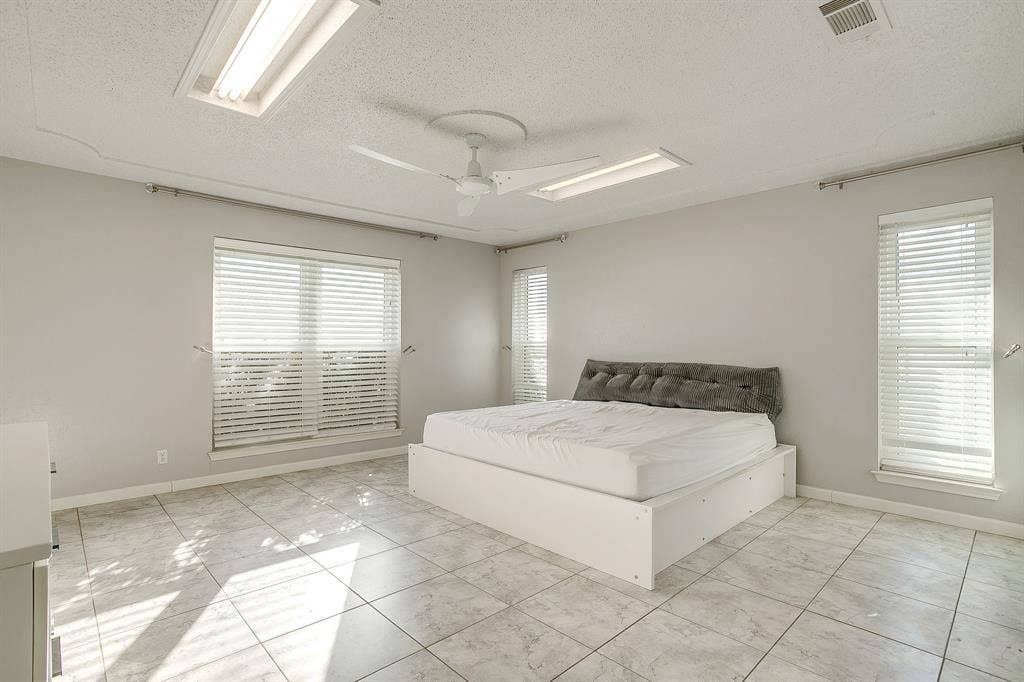407 Llano Court, Weatherford, TX 76087 Primary bedroom with natural lighting.