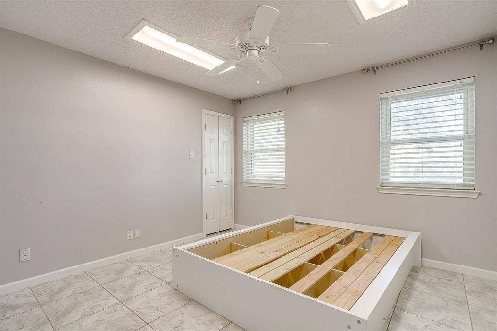 407 Llano Court, Weatherford, TX 76087 Third bedroom. Deep walk-in closet.