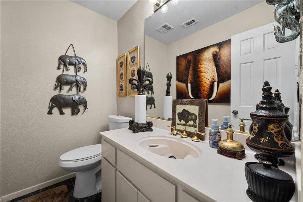 656 The Meadows Parkway, DeSoto, TX 75115 Single vanity with a light-colored countertop and integrated sink