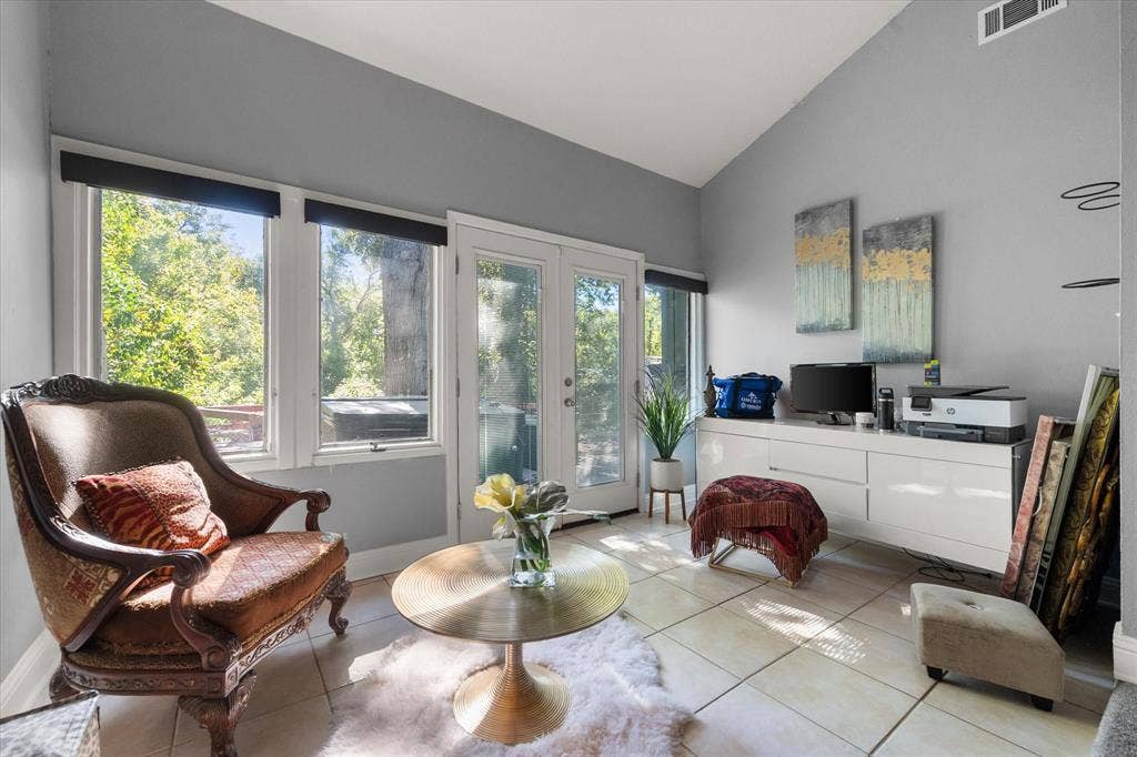 656 The Meadows Parkway, DeSoto, TX 75115 Vaulted ceilings, light-hued tile flooring, and multiple windows providing ambient light