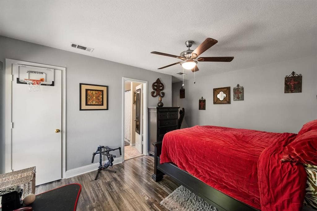 656 The Meadows Parkway, DeSoto, TX 75115 Wood-finish flooring, ceiling fan with integrated lighting, and light grey wall paint