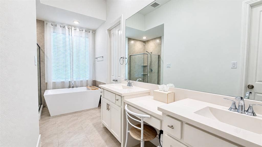 1613 Sandhill Lane, Celina, TX 75009 Dual vanity with light-colored countertops, white cabinetry, and polished chrome fixtures