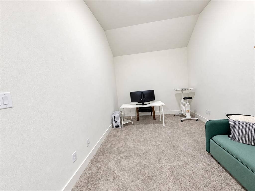 1613 Sandhill Lane, Celina, TX 75009 Neutral-toned carpet flooring, white painted walls, and an angled ceiling