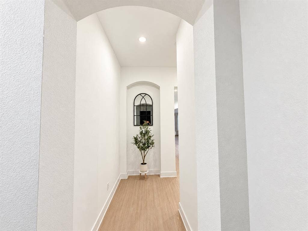 1613 Sandhill Lane, Celina, TX 75009 Archway entry with recessed lighting, wood-finish flooring, and white baseboards