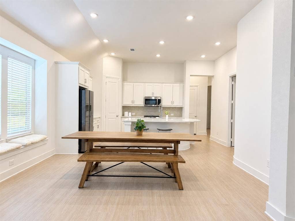 1613 Sandhill Lane, Celina, TX 75009 Open-concept living space featuring light wood-finish flooring, recessed lighting, and a window seat