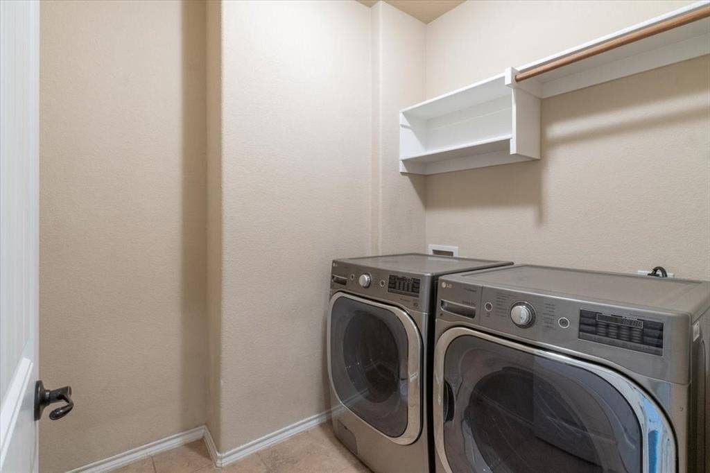 1713 Falling Star Drive, Fort Worth, TX 76052 Laundry area with built-in shelving and hanging rod