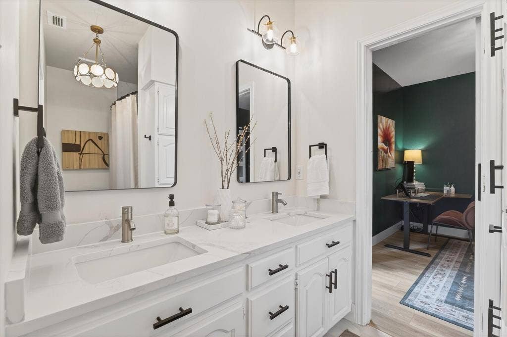 Dual vanity with integrated sinks and a stone-finish countertop