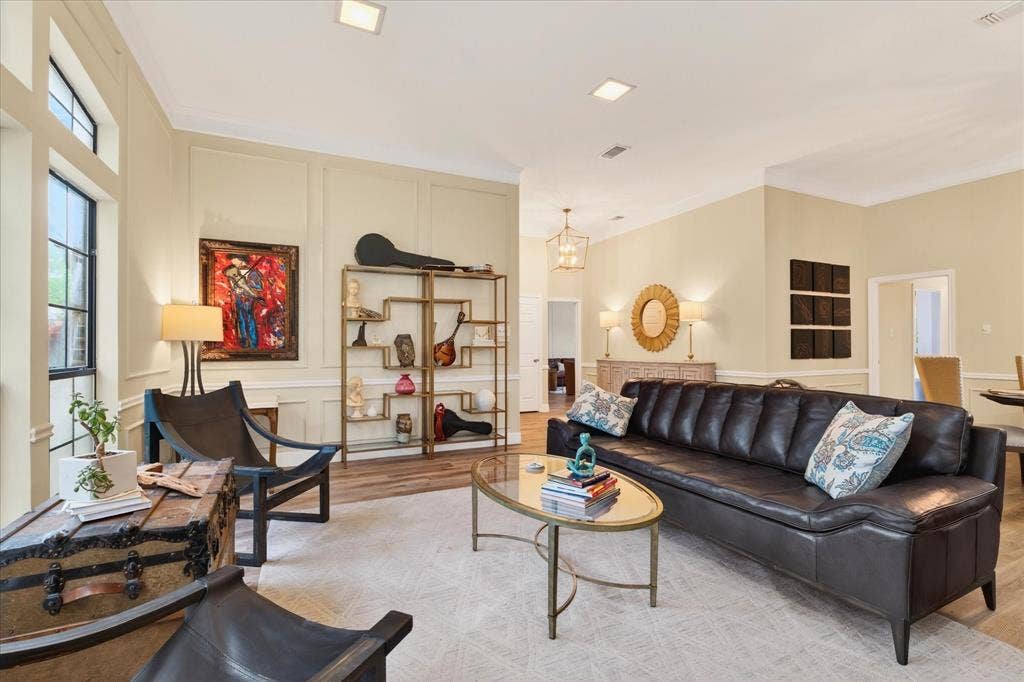 Recessed lighting, wood-finish flooring, and crown molding