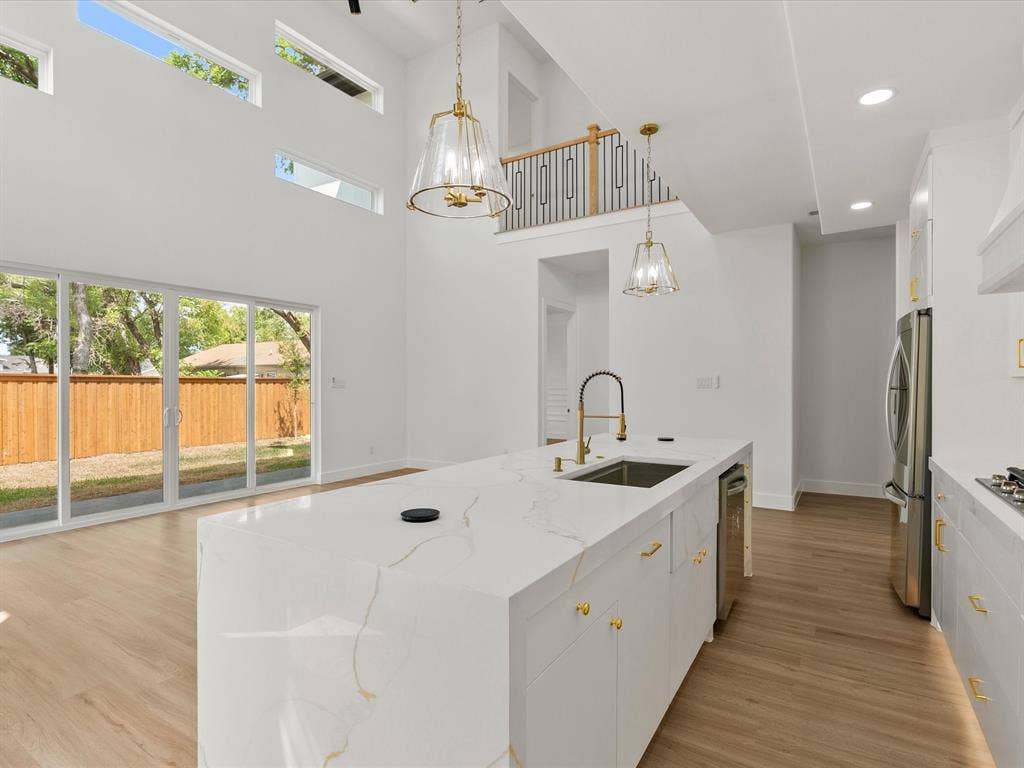 1711 Kraft Street, Dallas, TX 75212 water fall island, quartz countertops, stainless steel appliances