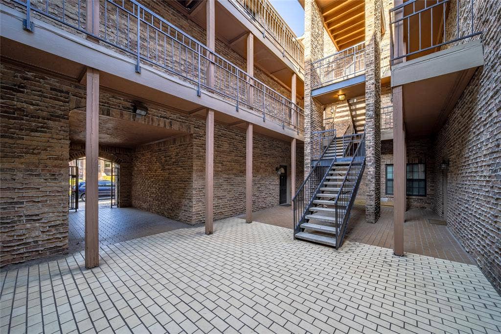 The entrance to Unit D is at the top of the stairs.
