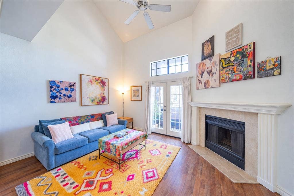 The living room has a vaulted ceiling that creates an open feeling.