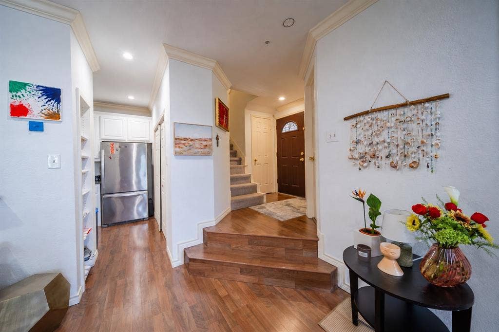 The entrance on the first level steps down into the living room and dining room.