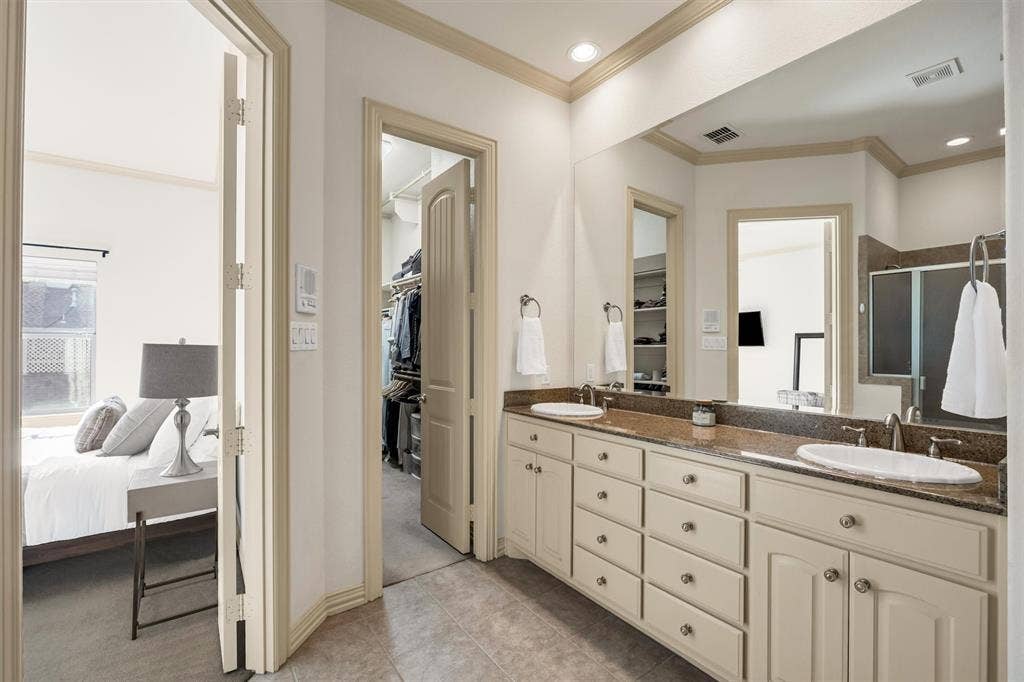 8249 Short Street, Frisco, TX 75034 Dual vanity with undermount sinks, substantial countertop, and extensive storage cabinetry