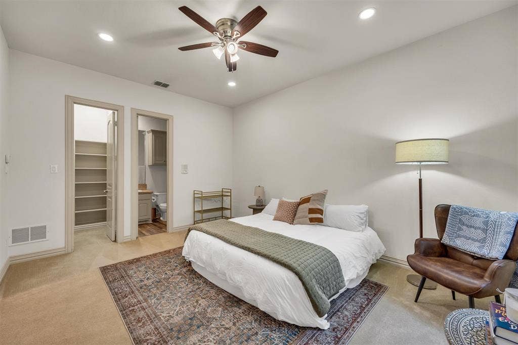 8249 Short Street, Frisco, TX 75034 Recessed ceiling lighting, ceiling fan with integrated lighting, carpeted flooring, built-in shelving, and wood-finish flooring in the bathroom
