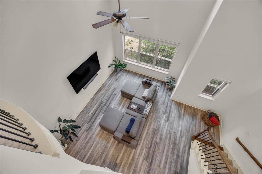 8249 Short Street, Frisco, TX 75034 Vaulted ceiling, wood-finish flooring, ceiling fan, large window, and skylight