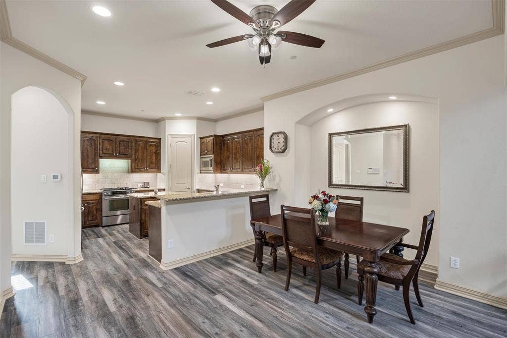 8249 Short Street, Frisco, TX 75034 Kitchen and dining area featuring wood-finish flooring, recessed lighting, and a ceiling fan