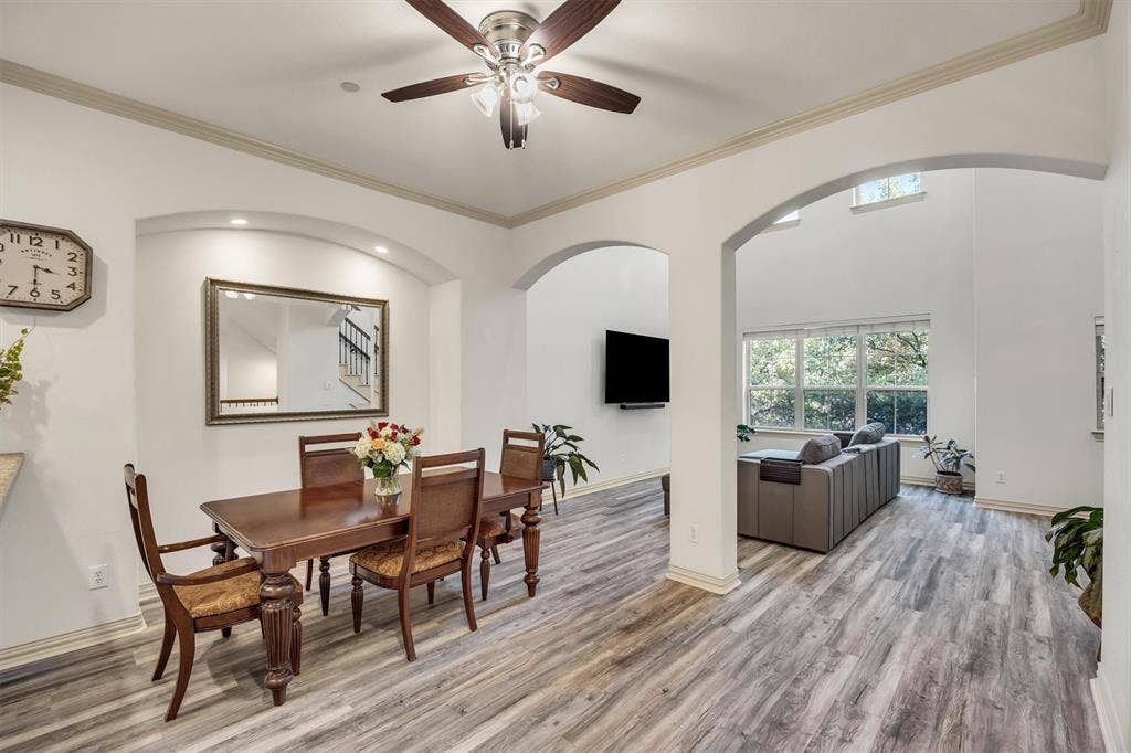8249 Short Street, Frisco, TX 75034 Wood-finish flooring throughout, arched doorways, recessed lighting, ceiling fan, and crown molding