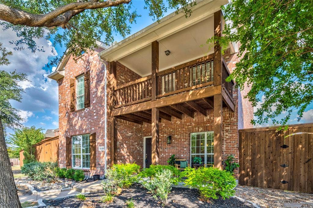10138 Planters Row Drive, Frisco, TX 75033 Brick construction, mature trees, and a covered upstairs balcony give this West Frisco home classic curb appeal.